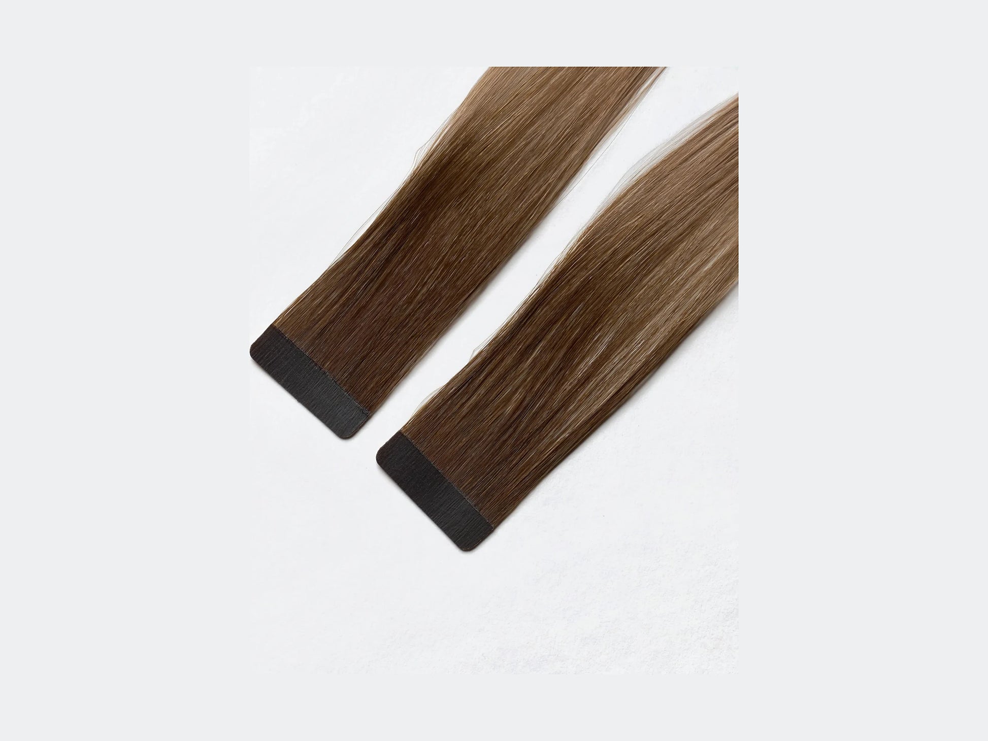 Tape Extensions Kairo, närbild på det förtejpade fästet