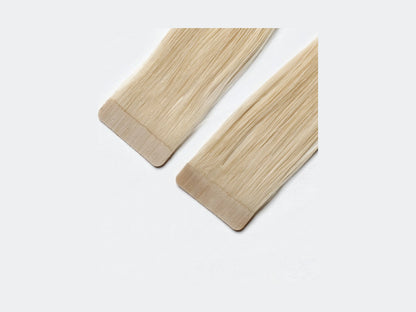 Tape Extensions Mykonos, närbild på det förtejpade fästet